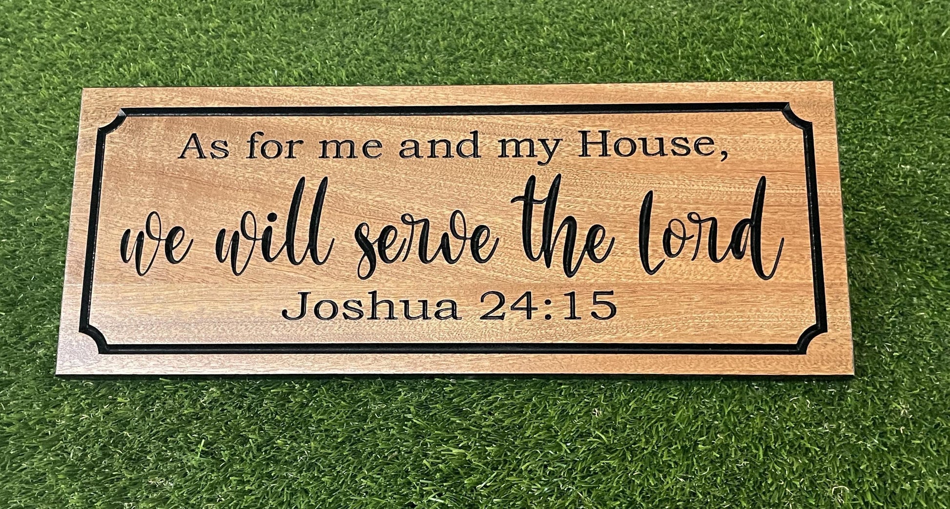 a wooden sign that says as for me and my house we will serve the lord