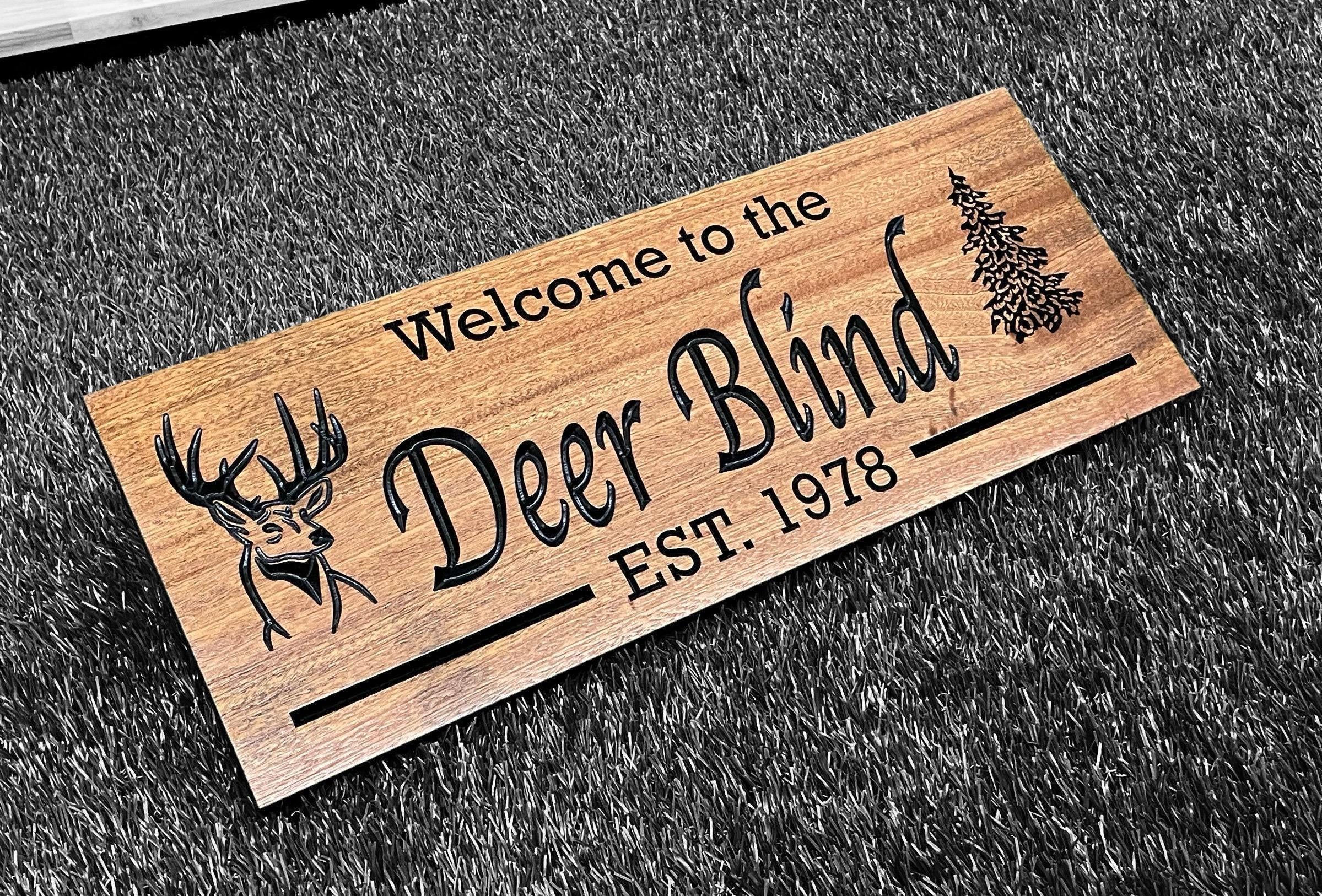 a wooden sign that reads, welcome to the deer blind