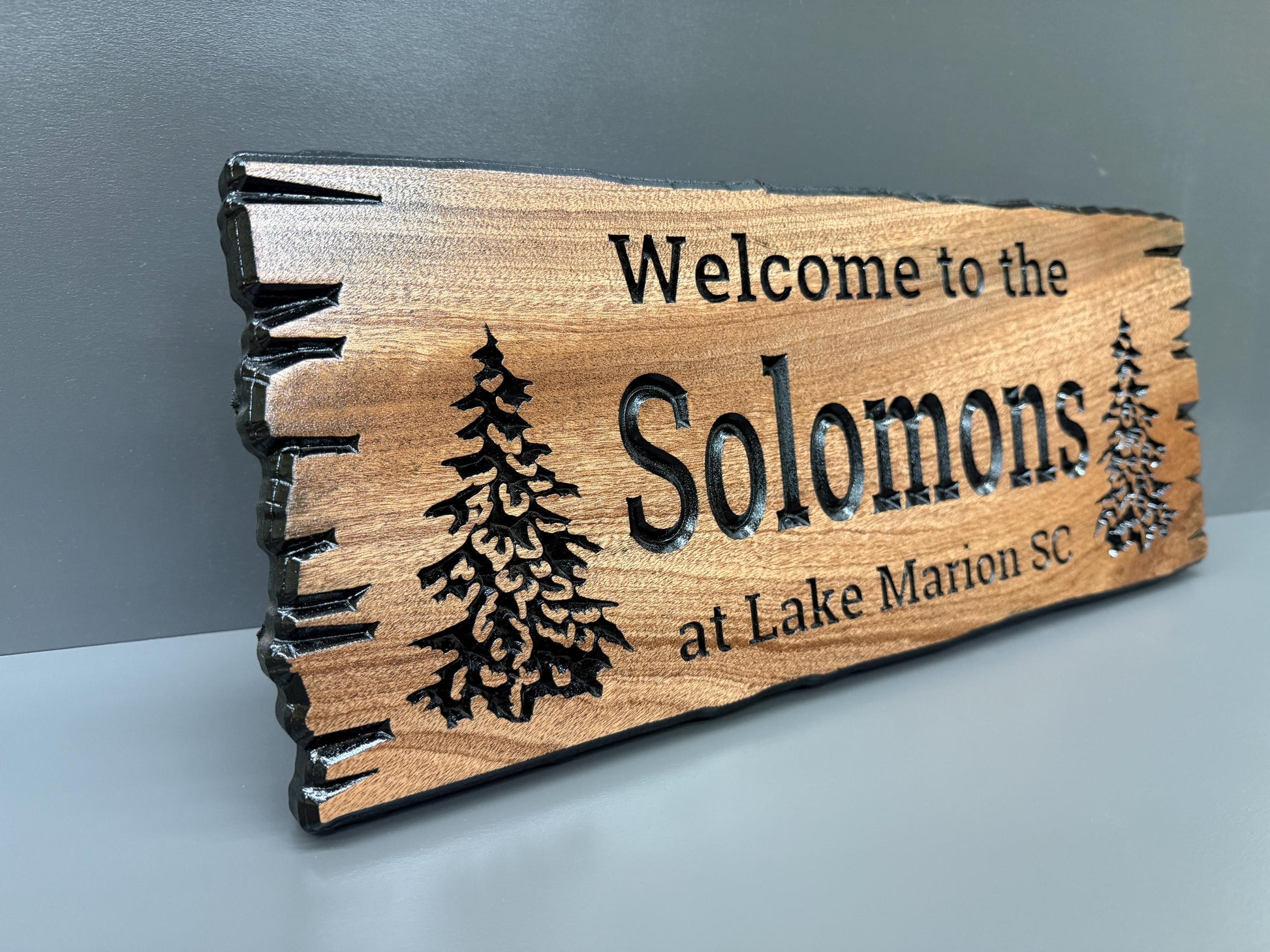 a wooden sign with the text "Welcome to the Solomons at Lake Marion Sc."