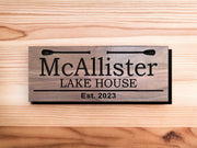 a wooden sign that says mcallister lake house