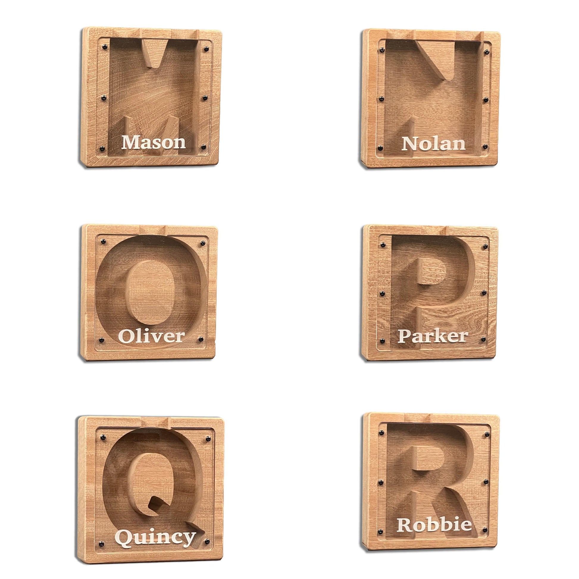 six wooden letters, each with a name written on it, arranged in a grid.