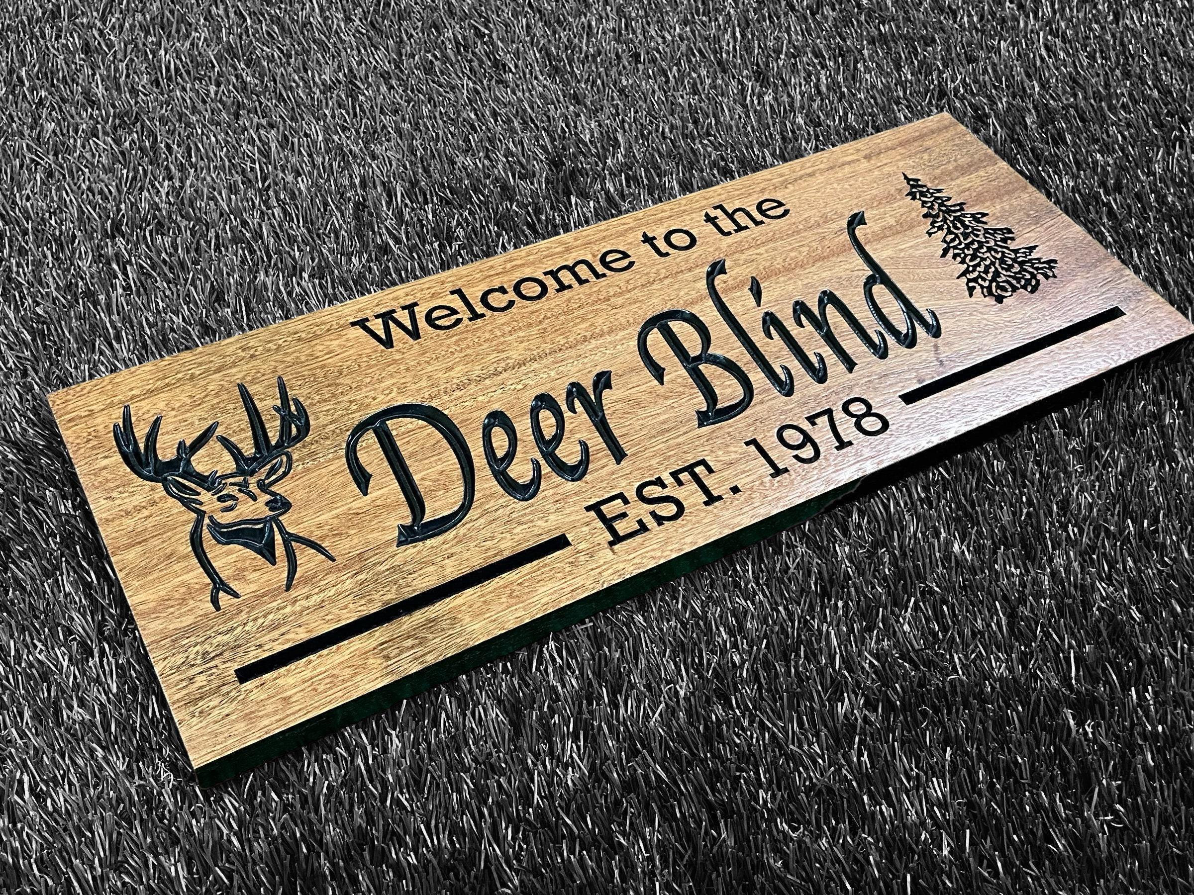 a wooden sign that says welcome to the deer blind