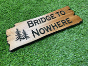 a wooden sign that says bridge to nowhere