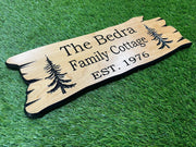 a wooden sign that reads the bedra family cottage