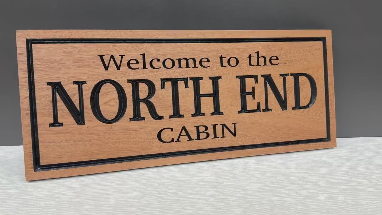 Load video: Personalized Cabin Sign, Custom Carved Wood Cabin Name Sign, Welcome to the Cabin, Lake House Decor, Cabin Owner Housewarming Gift