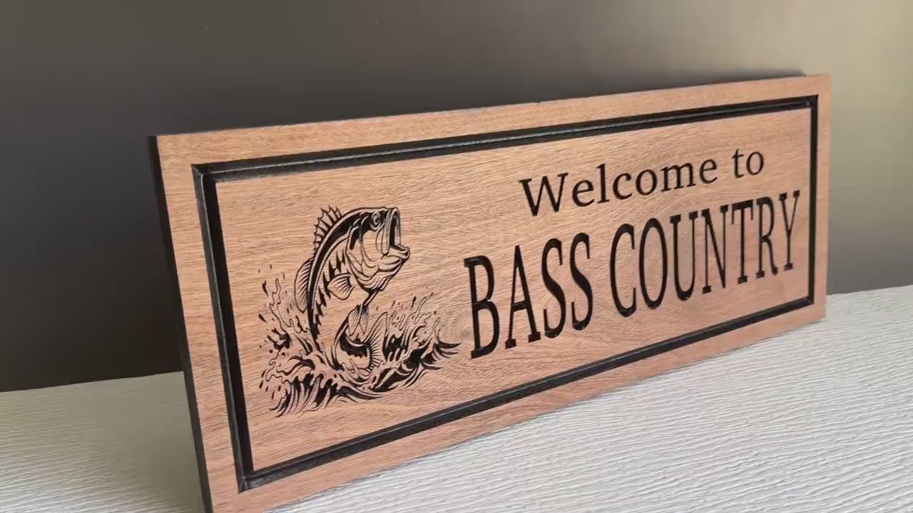 Load video: Carved Wood Pine Tree, Fish, Bass Fish, Fishing Sign, Bass Fishing Sign, Fisherman Gift, Hardwood Fishing Cabin Sign, Lake House Dock Decor