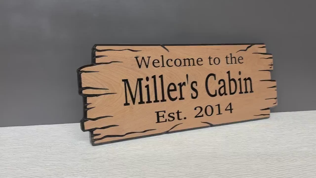 Load video: Rustic Gift Family Name Signs, Custom Camp Sign Wooden Sign Custom Signs, Housewarming Gift, Personalized Cabin Sign, Carved Wooden Sign