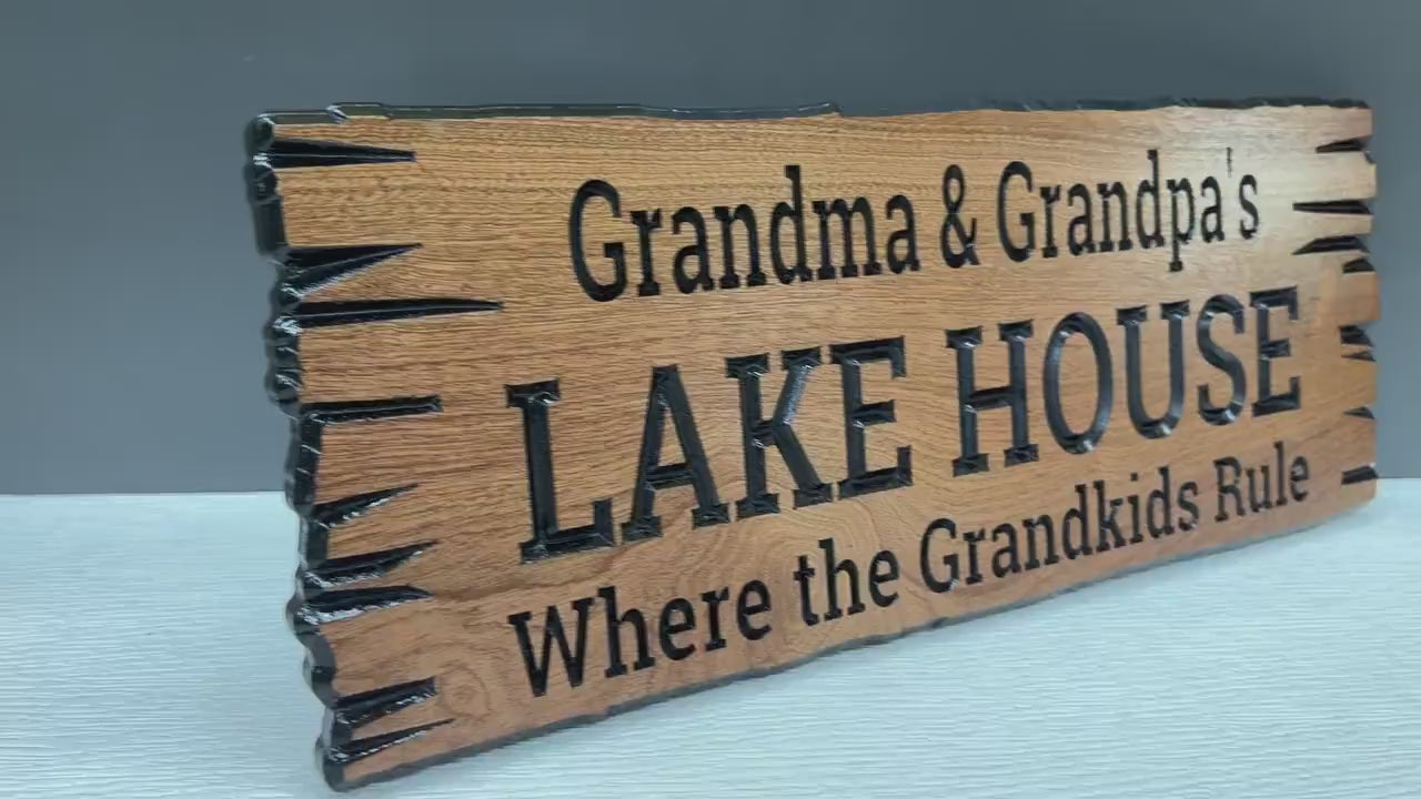 Load video: Grandma and Grandpa Lake House Sign Custom Wood Live Edge, Grandparent Cabin Sign Personalized, Grandparents Lake Sign Carved